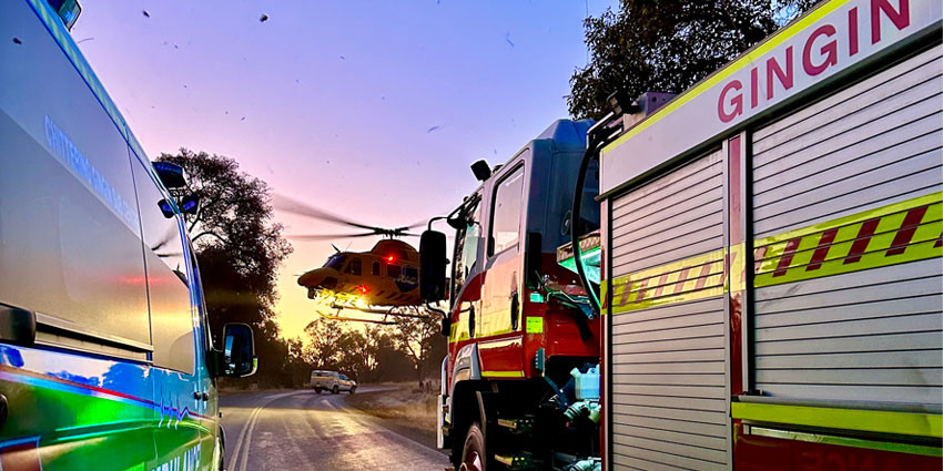 Fire tuck, ambulance and rescue helicopter in the bush